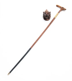TWO CARVED WOOD ITEMS: A CANE AND A LIONS HEAD.