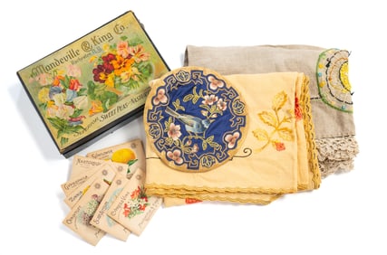 THREE EMBROIDERIES AND A BOX OF SEEDS.