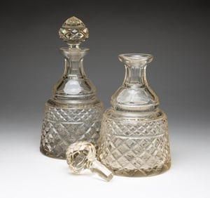TWO CUT GLASS DECANTERS.