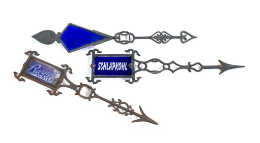 THREE LIGHTNING ROD DIRECTIONALS WITH BLUE GLASS INSERTS.