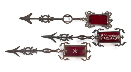 THREE LIGHTNING ROD DIRECTIONALS WITH RUBY GLASS INSERTS.