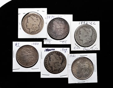 SIX SILVER MORGAN DOLLARS.