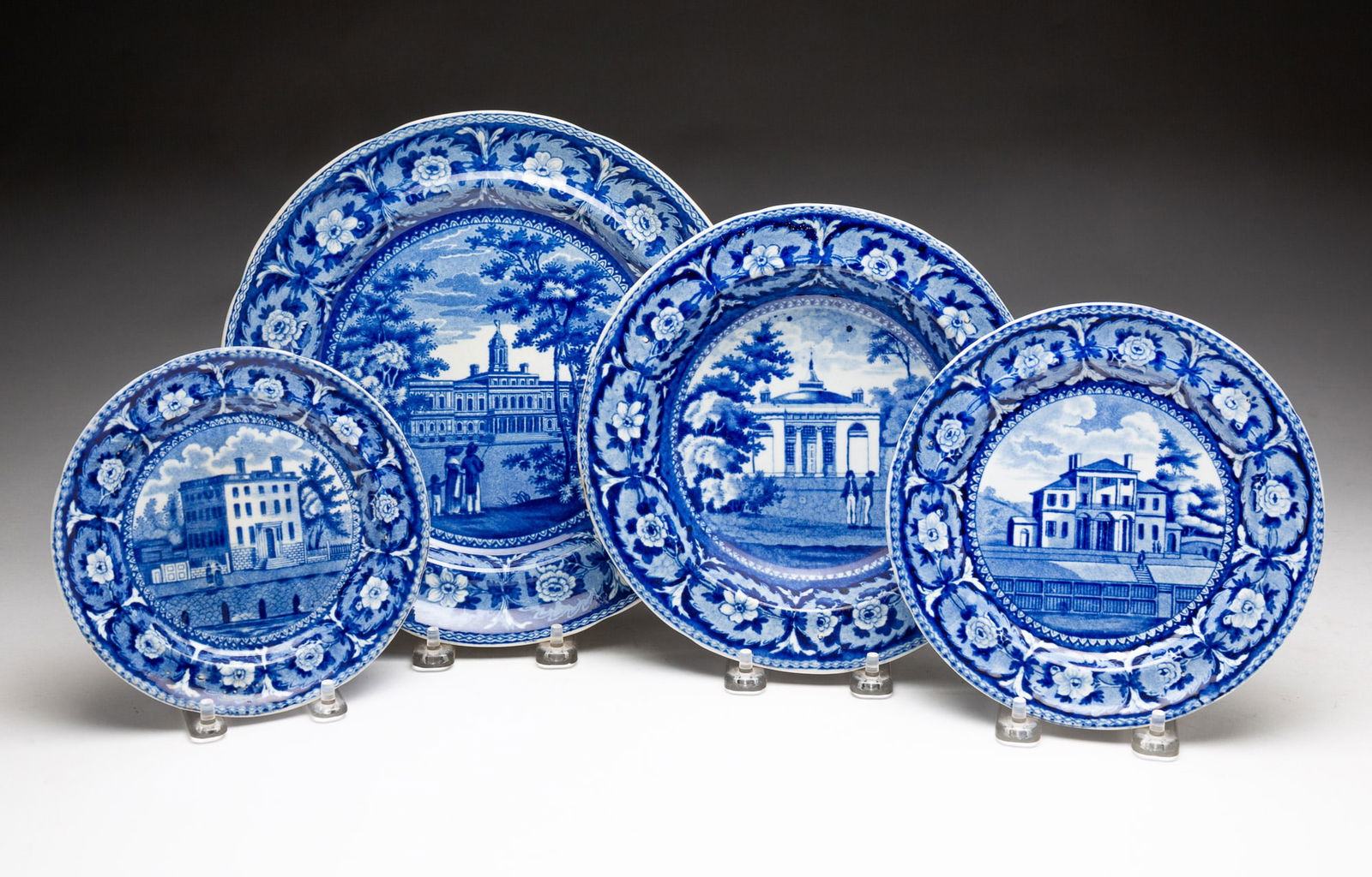 FOUR RIDGEWAY HISTORICAL BLUE STAFFORDSHIRE DISHES.: England, 19th Century. From "Beauties of America" series. Includes "Atheneum, Boston" plate, 6.25"d., "Stapghtons Church, Philadelphia", 8.25"w., "Insane Hospital, Boston" plate, 7.25"d., and "City Ha