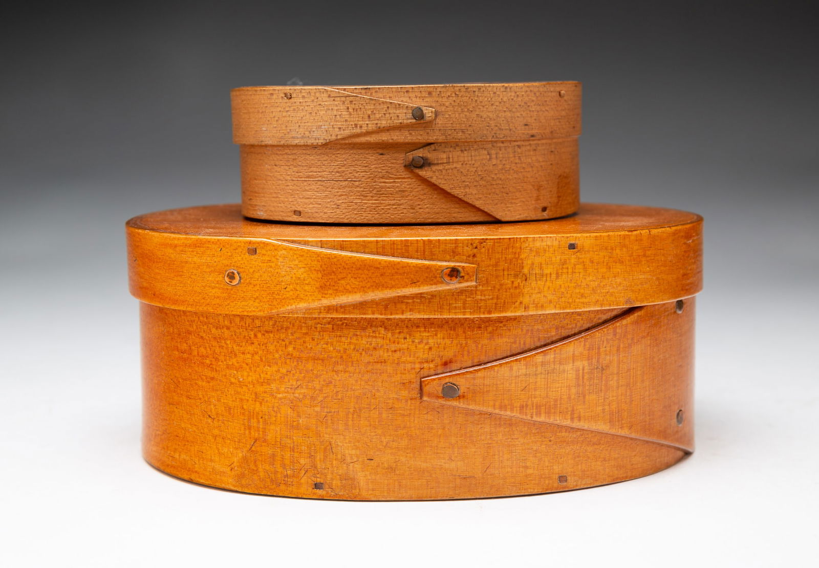 TWO OVAL HARVARD JOINT BOXES. (1 of 4)