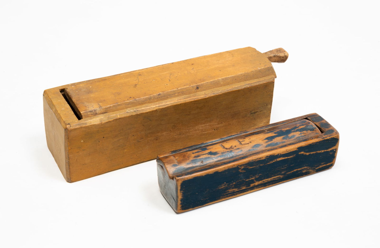 TWO HAND CARVED SLIDE LID WOOD BOXES. (1 of 2)