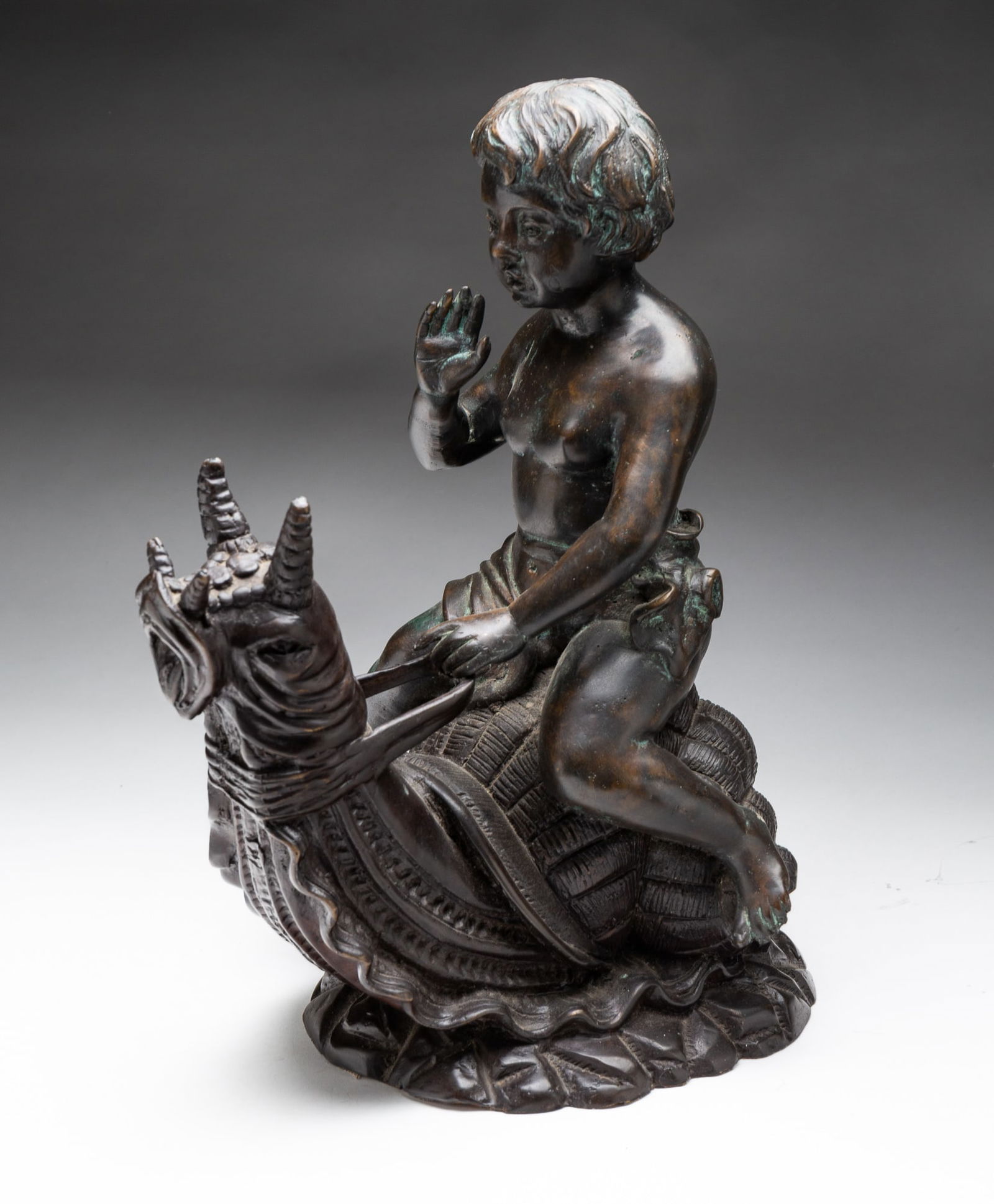 CHERUB RIDING A SNAIL BRONZE BY MAITLAND SMITH. (1 of 5)