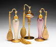 THREE ART GLASS PERFUME ATOMIZERS BY DEVILBISS.
