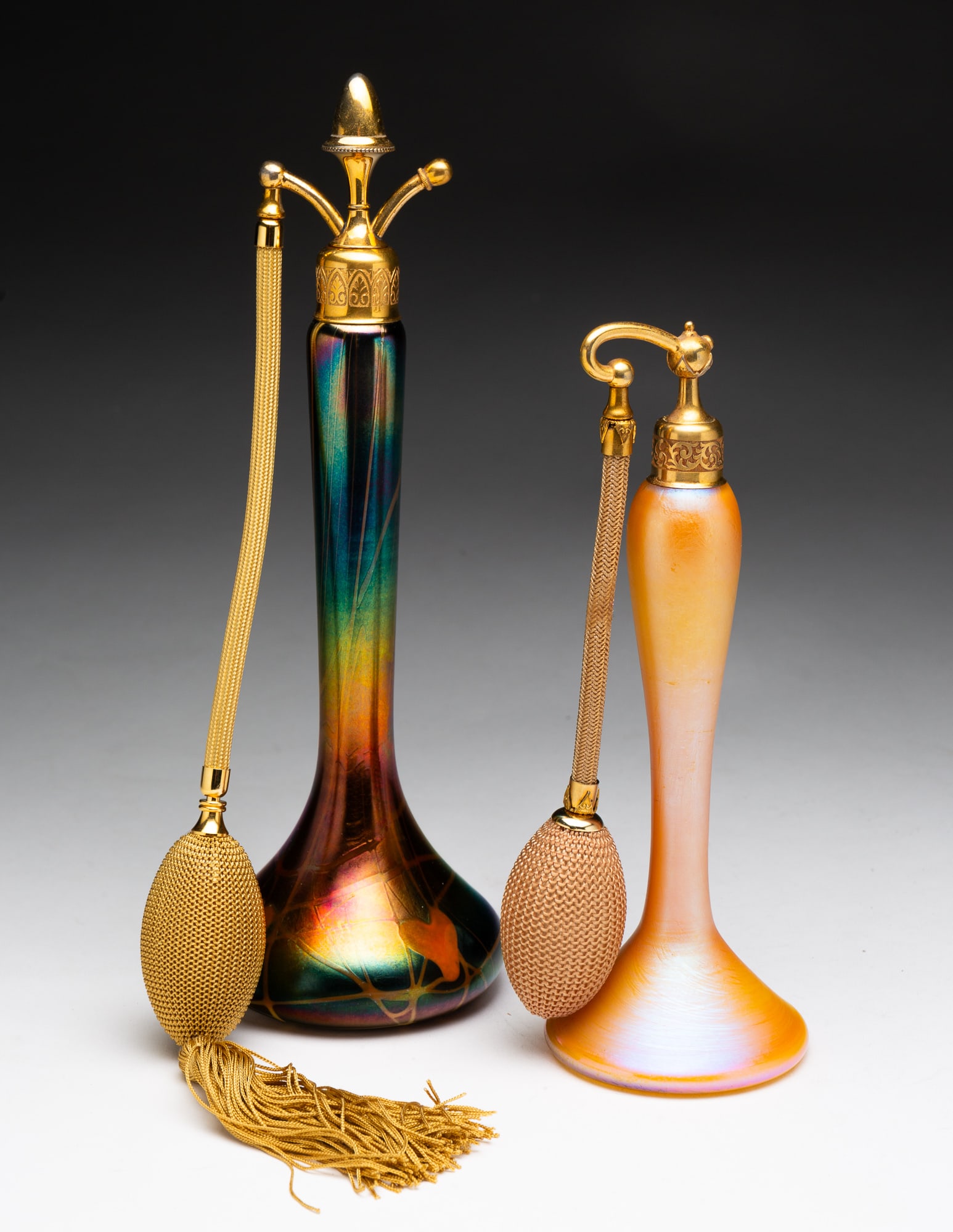 TWO IRIDESCENT ART GLASS PERFUME ATOMIZERS BY DEVILBISS. (1 of 7)