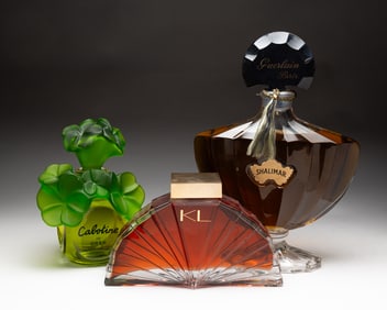 THREE LARGE PERFUME DISPLAY BOTTLES.