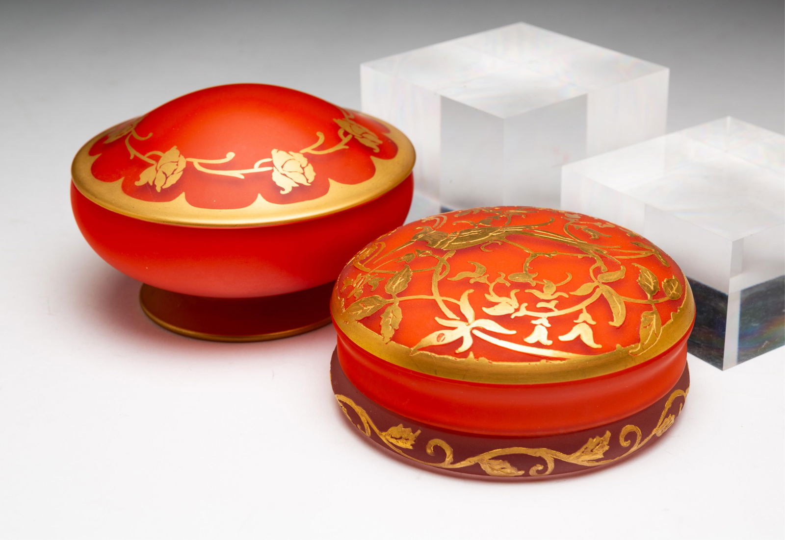 TWO ART GLASS POWDER JARS BY DEVILBISS. (1 of 3)