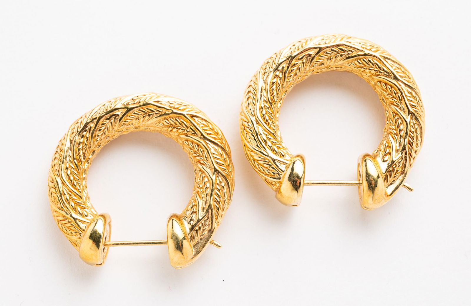 18K YELLOW GOLD CHIMENTO HOLLOW HOOP EARRINGS.: Contemporary. 18k yellow gold. Hollow hoops in an rope textured design. 1.3"d. Approximately 5.45 dwt. **Note: Bidders who are not yet established with our firm will be required to pay for jewelry, co