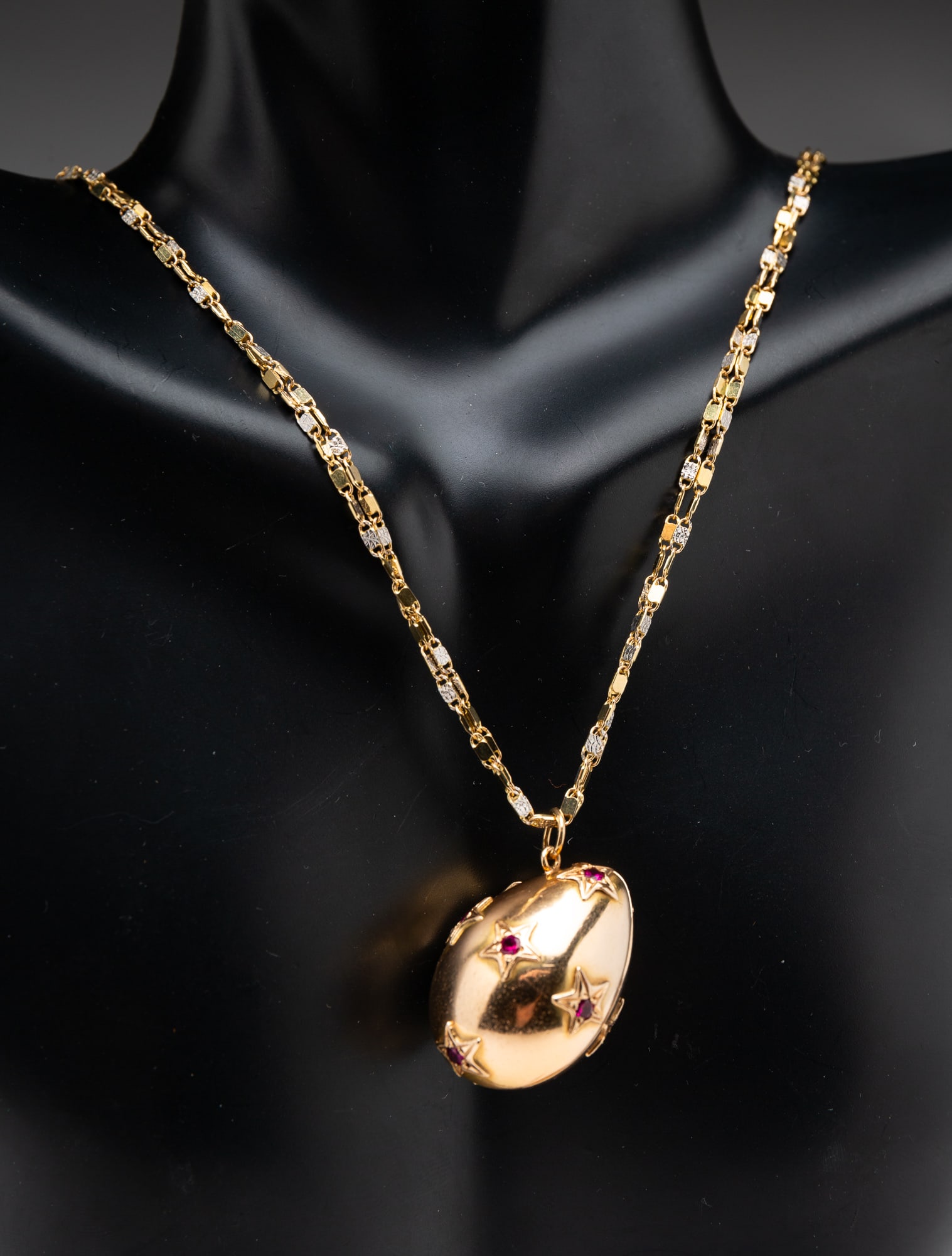 14K YELLOW GOLD NECKLACE WITH RUBY ACCENTED EGG LOCKET. (1 of 3)