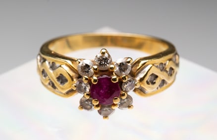 YELLOW GOLD RUBY AND DIAMOND RING.