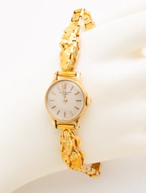 PATEK PHILIPPE WATCH WITH GOLD NUGGET BAND.