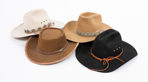 FOUR COWBOY HATS.