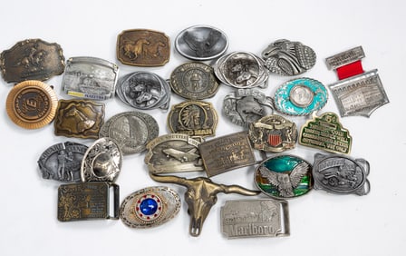 TWENTY-SEVEN METAL BELT BUCKLES.