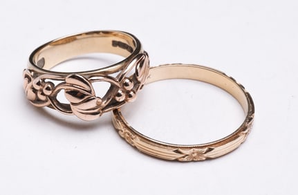 TWO YELLOW GOLD RINGS.