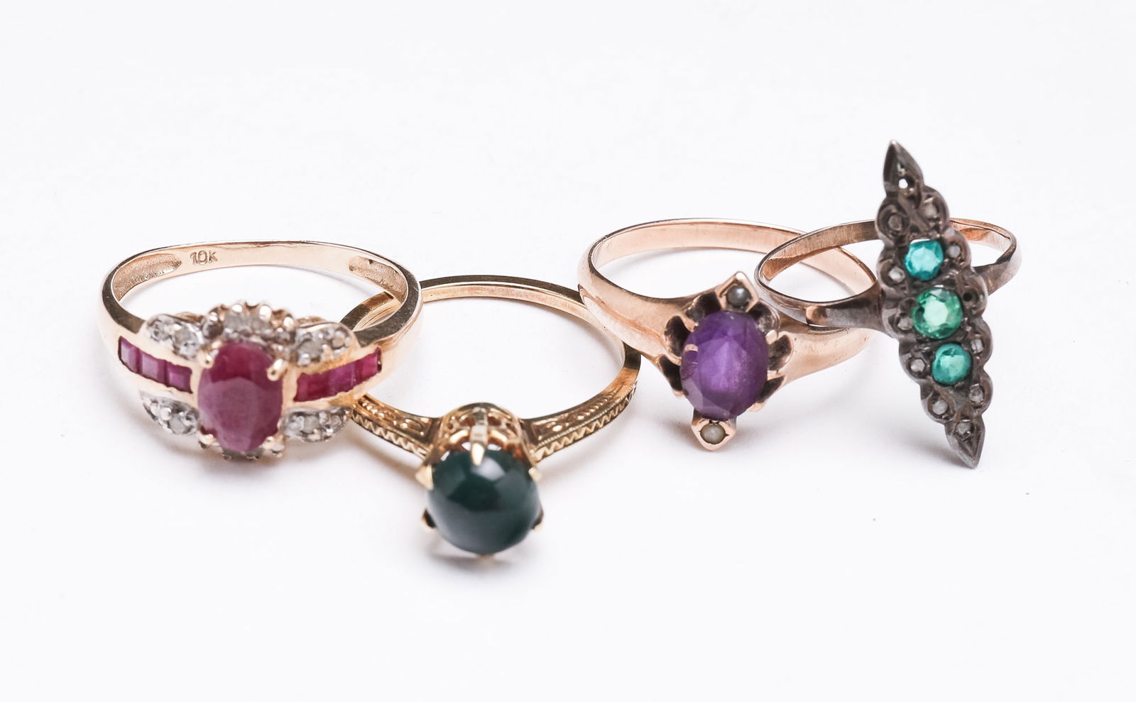 FOUR YELLOW GOLD GEMSTONE RINGS. (1 of 2)