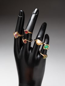 SIX YELLOW GOLD GEMSTONE RINGS.