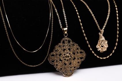 FOUR 14K YELLOW GOLD NECKLACES.