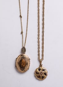 TWO GOLD FILLED LOCKETS.