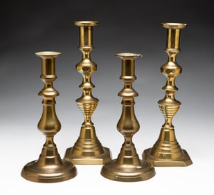 TWO PAIRS OF BRASS CANDLESTICKS.