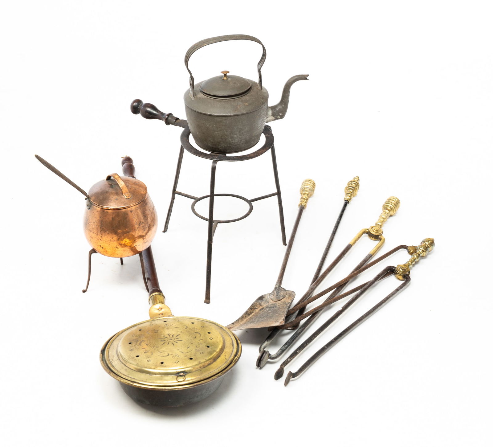 GROUP OF HOUSEHOLD FIREPLACE ITEMS.: American, 19th Century. Mostly hearth and kitchen items. Including five forged iron hearth tools with brass accents, lidded copper pot with forged three legged trivet, a brass bed warmer with turned w
