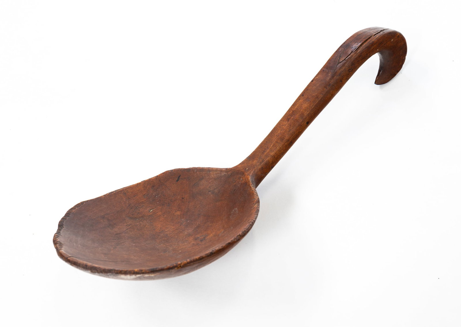 MAPLE SCOOP WITH CARVED HANDLE.: American, 19th Century. Maple. Nicely formed bowl with raised spine, long handle, and shaped hook. 13.5"l. From the lifetime collection of the late Audree and Bryce Chase (Port Royal, South Carolina).
