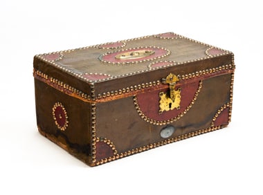 FINE LEATHER COVERED BOX WITH BRASS TACK TRIM.