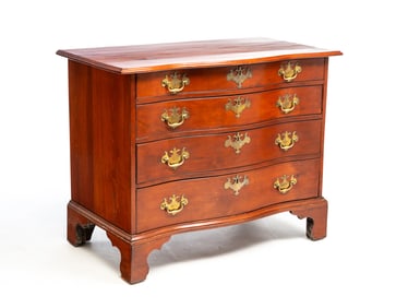 NEW ENGLAND CHERRY CHIPPENDALE SERPENTINE FRONT CHEST OF DRAWERS.