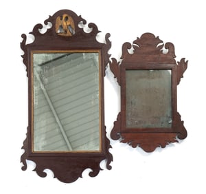 TWO CHIPPENDALE SCROLL MIRRORS.