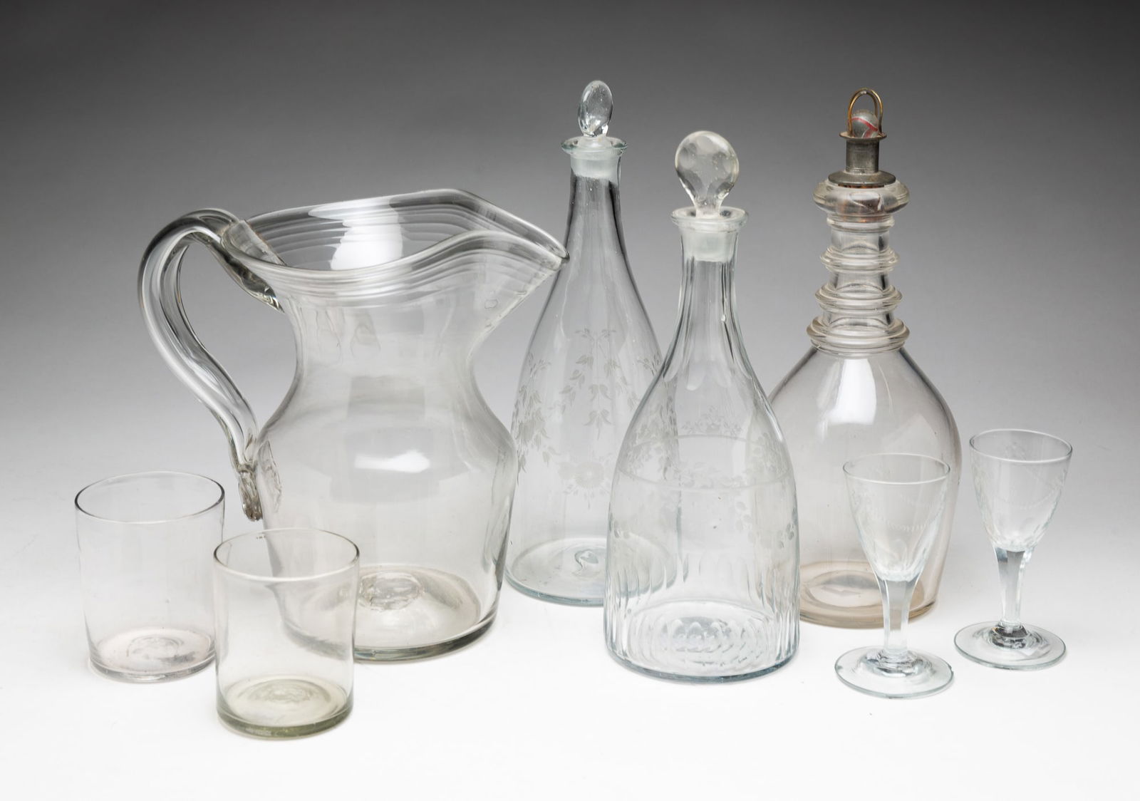 A SELECTION OF EARLY BLOWN FLINT GLASS. (1 of 6)