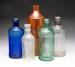 FIVE LARGE INK BOTTLES.