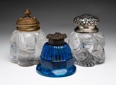 THREE GLASS INKWELLS.