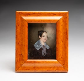 FRAMED MINIATURE PORTRAIT OF A WOMAN WITH GLASSES.