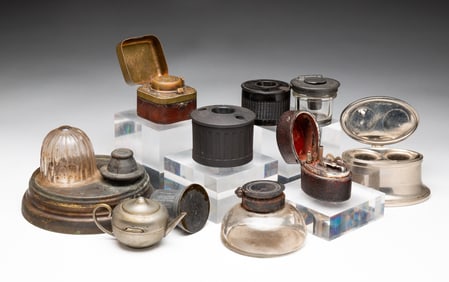 GROUP OF TEN INKWELLS.