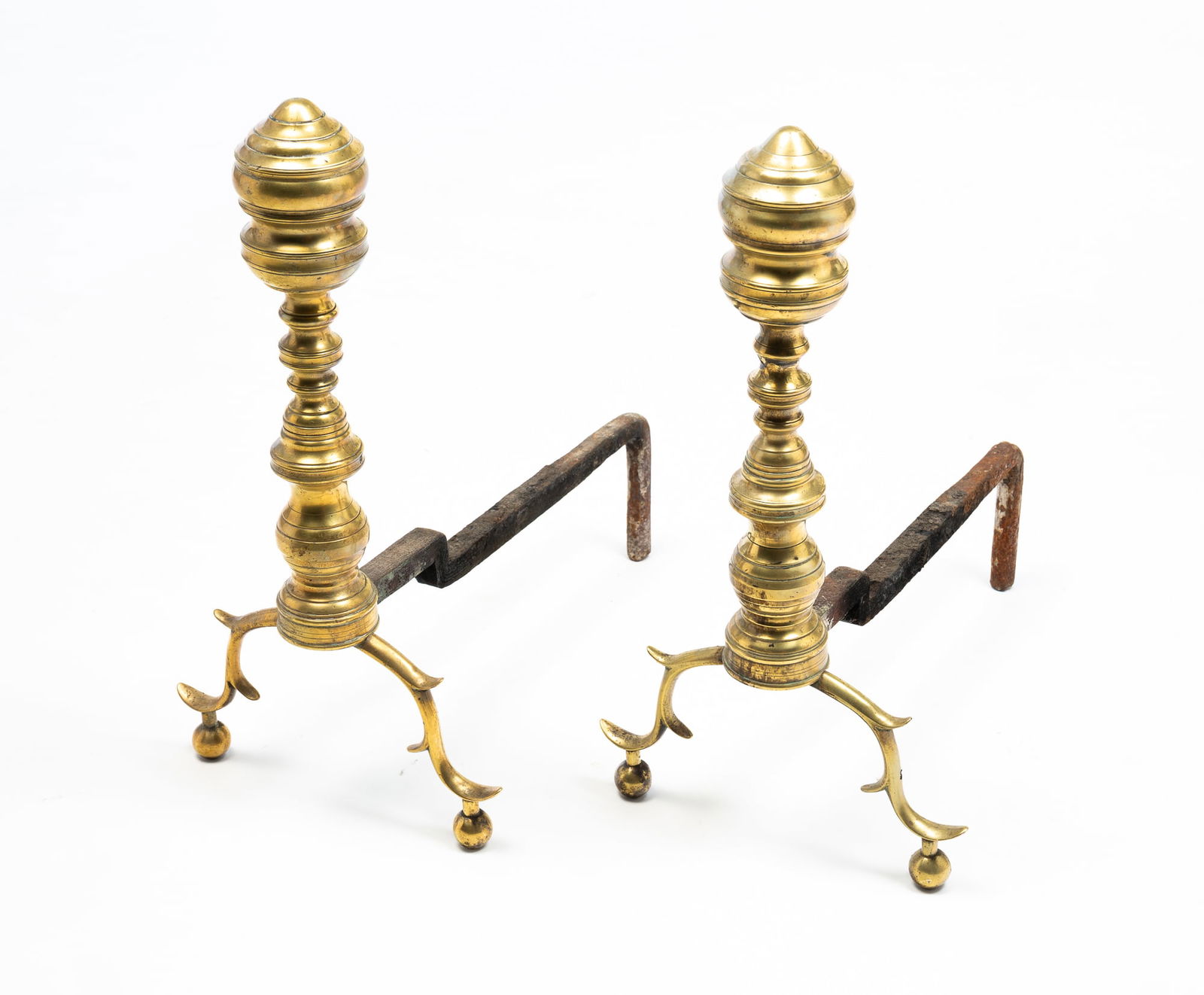 PAIR OF FEDERAL PERIOD ANDIRONS.: American, 19th Century. Brass. Seamed construction, bulbous finials, spurred legs, and ball feet. 18"h. 10"w. 26.5"d. From the lifetime collection of the late Audree and Bryce Chase (Port Royal, South