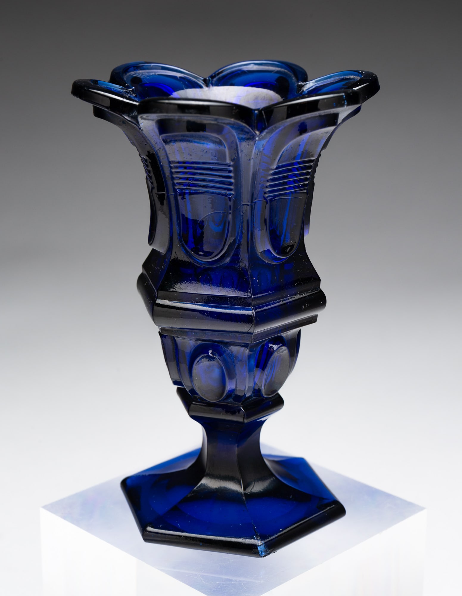 SANDWICH FLINT GLASS VASE.: American, 19th Century. Cobalt with flare scalloped rim, hexagonal shape, buckle and thumbprint variant and polished pontil 4.75"h.