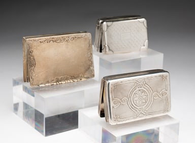 THREE STERLING SILVER SNUFF BOXES.