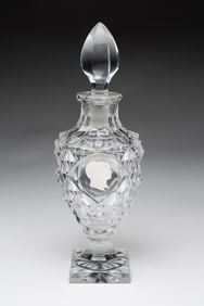 CUT GLASS COLOGNE WITH SULFIDE BUSTS.