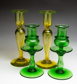 TWO PAIR OF COLORED GLASS CANDLESTICKS.