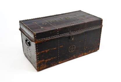 LEATHER COVERED TRUNK WITH BRASS TACK DECORATION AND MONOGRAM.