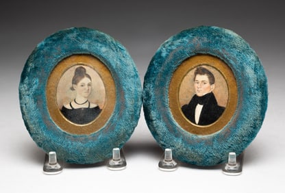 PAIR OF MINIATURE PORTRAITS OF HUSBAND AND WIFE.