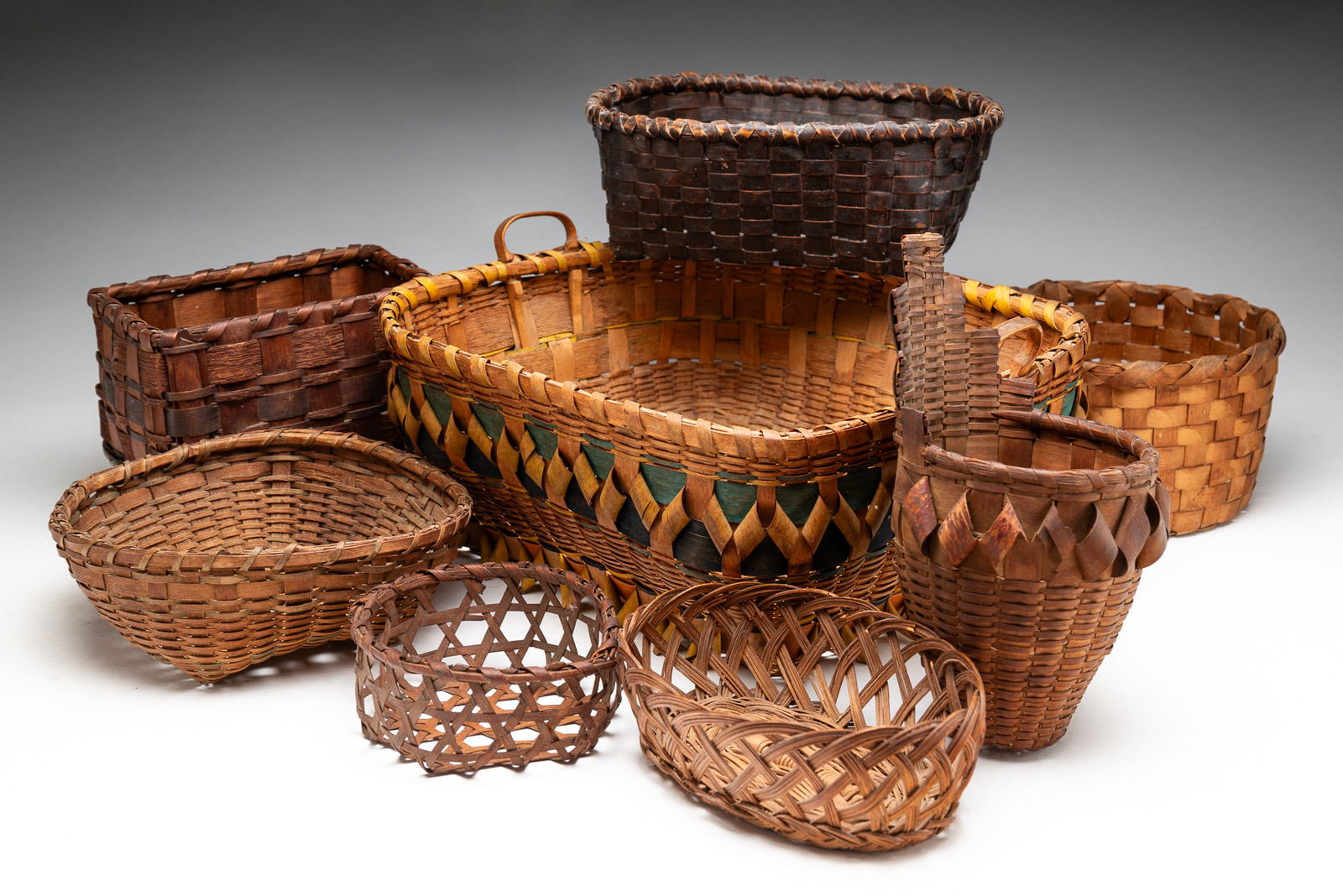 EIGHT FINE WOVEN BASKETS. (1 of 3)