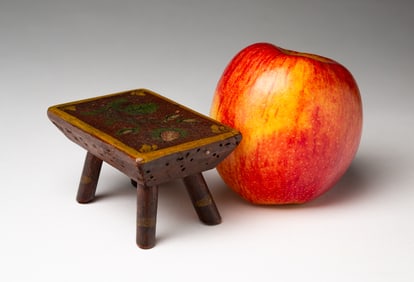 EXCEPTIONAL MINIATURE PAINT DECORATED SPLAYED LEG STOOL.