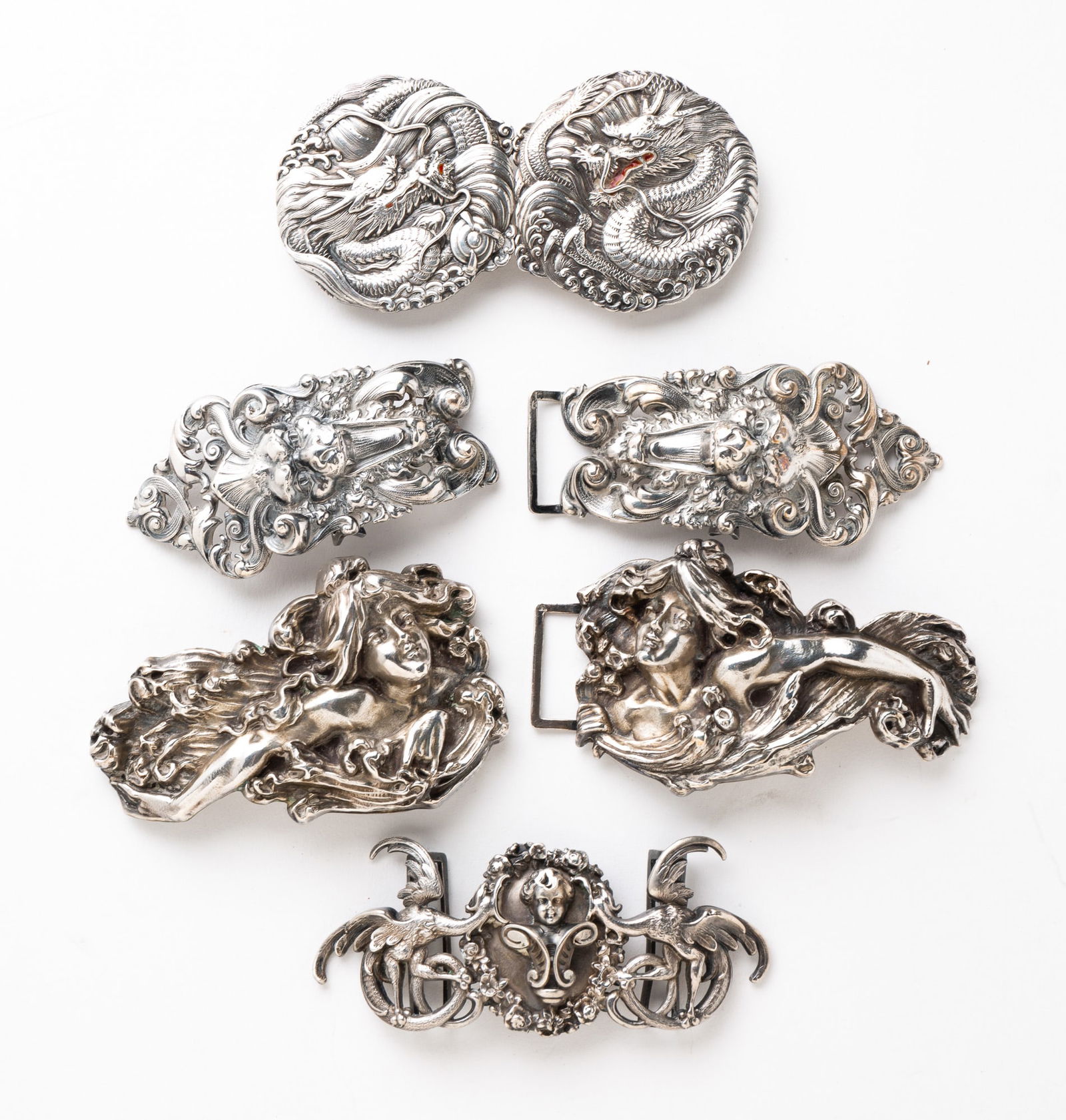 FOUR STERLING BUCKLE SETS. (1 of 7)