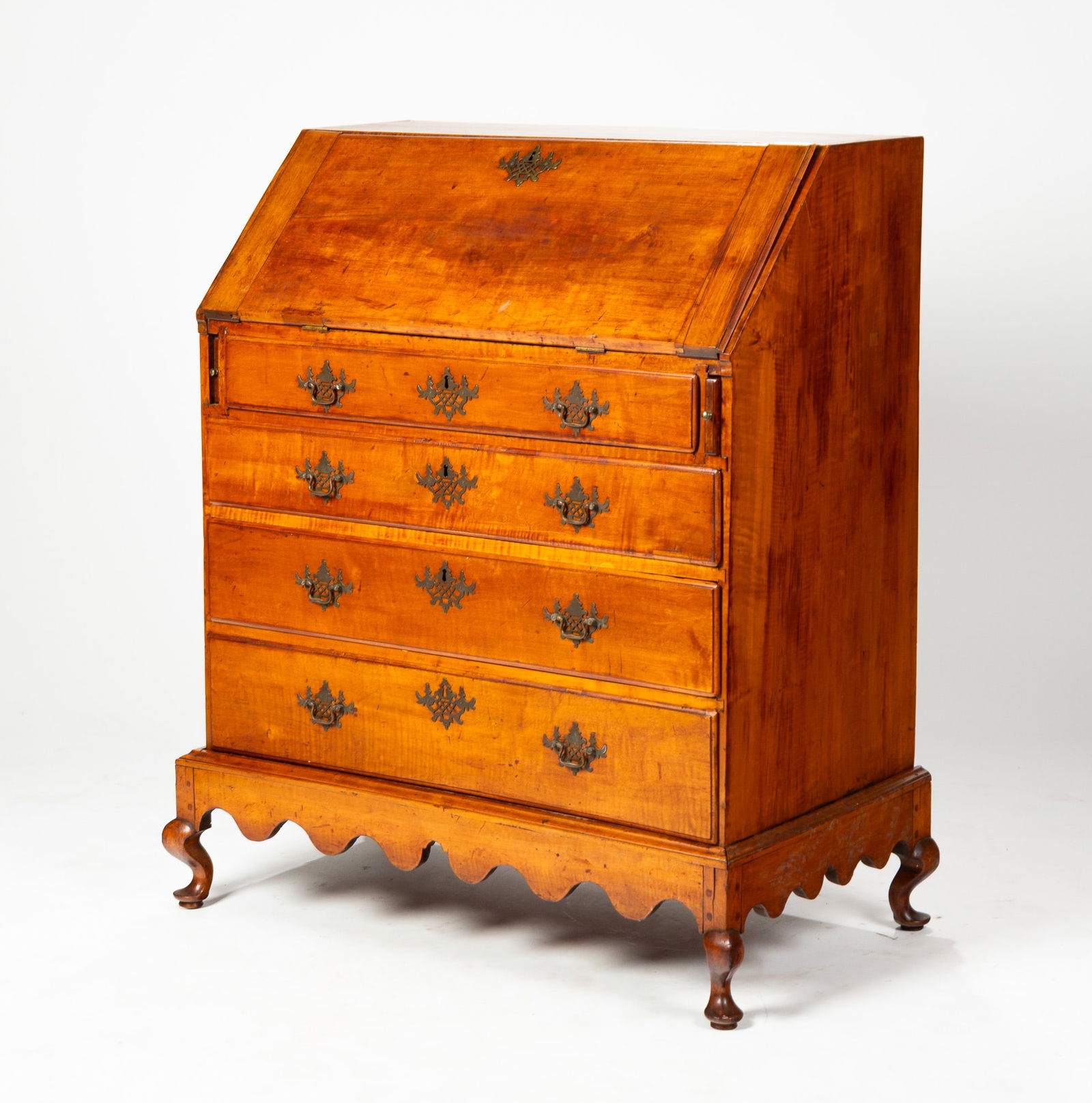 QUEEN ANNE FIGURED MAPLE DESK-ON-FRAME.