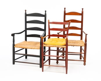 THREE LADDER BACK ARM CHAIRS.