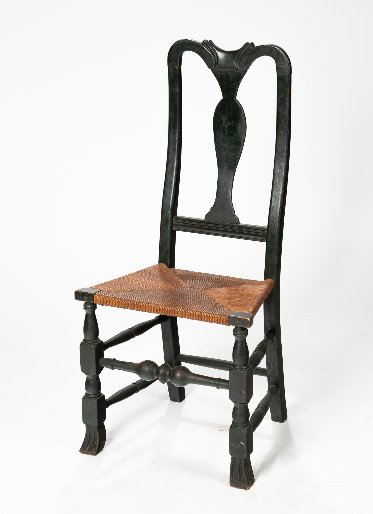 QUEEN ANNE SIDE CHAIR.: American (New England), circa 1740-1780. Shaped crest, spooned vase splat, block and spool front legs, boldly turned front stretcher, Spanish feet and rush seat. 18" seat. 41.5"h.