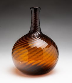 FINE ZANESVILLE AMBER SWIRL RIB BLOWN GLASS BOTTLE.